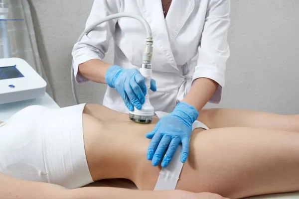 Lost the Weight but Not the Loose Skin? 2 woman having HIFU treatment on her stomach to combat loose skin Wincanton following weight loss